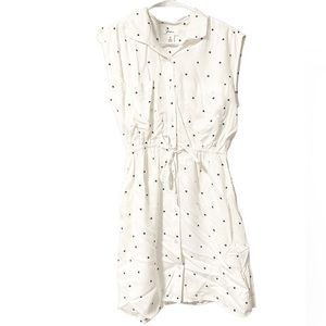 White romper with buttons and a string to tie around